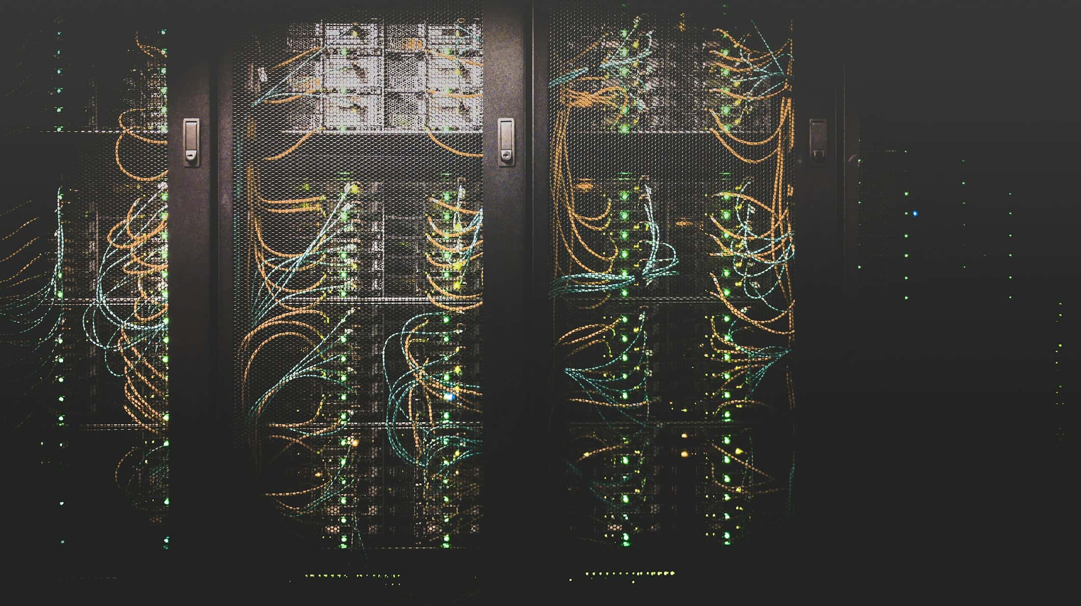 Network cables plugged into a server rack