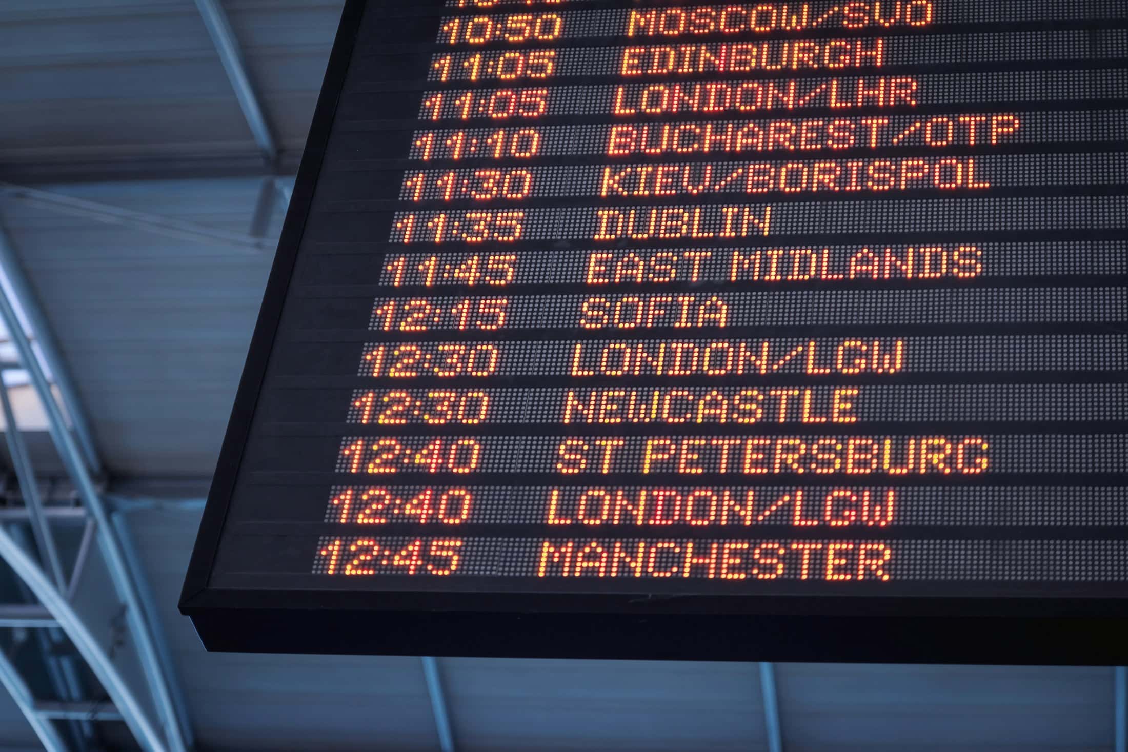 A departures board at night